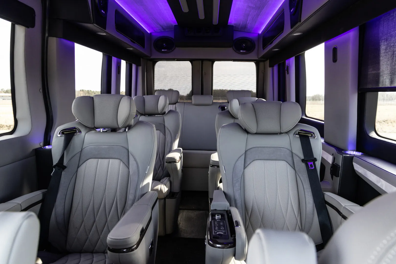 Seating Area with Cool lighting Waldoch Boundary Water Edition Conversion Van 9 Passenger Family Van Best Travel Vehicle
