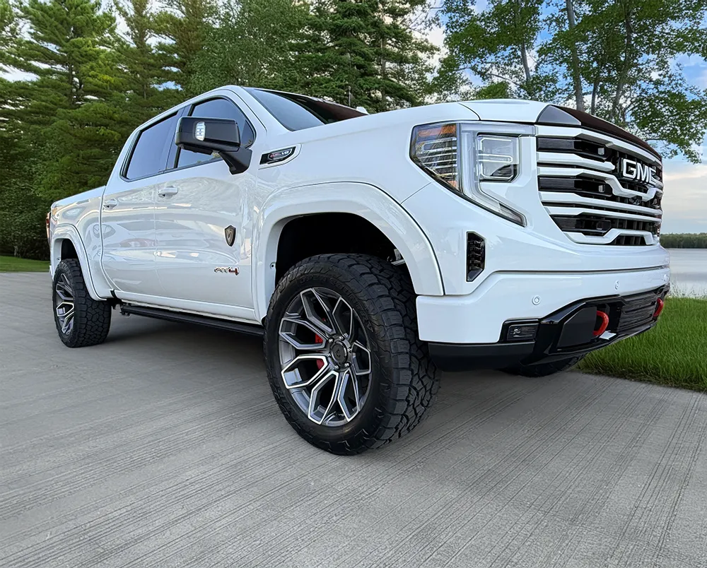 gmc-1500-m80-white-pass-side-low-quarter-front